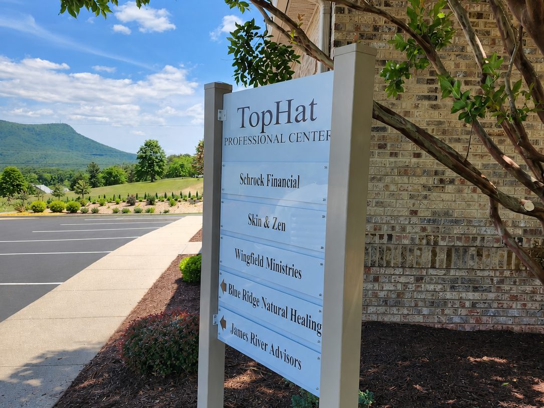 TopHat Professional Center directory sign with mountain backdrop